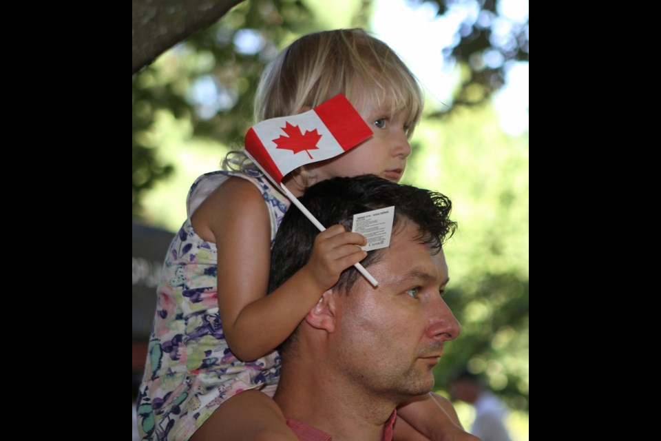 Sophie, 3, perched on her dad, Daniel Kolda's shoulders during the annual Canada Day parade at Burnaby Village Museum.