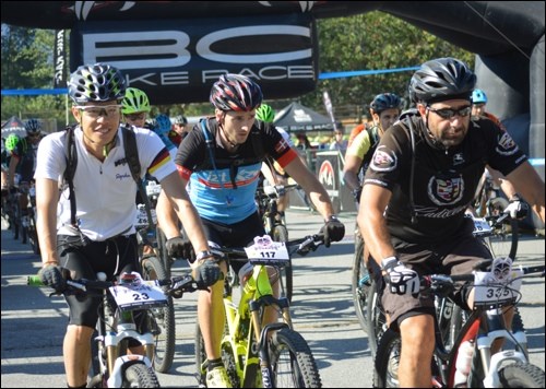 Riders blast off the finish line of the СƵBR in Squamish on Friday (July 3).