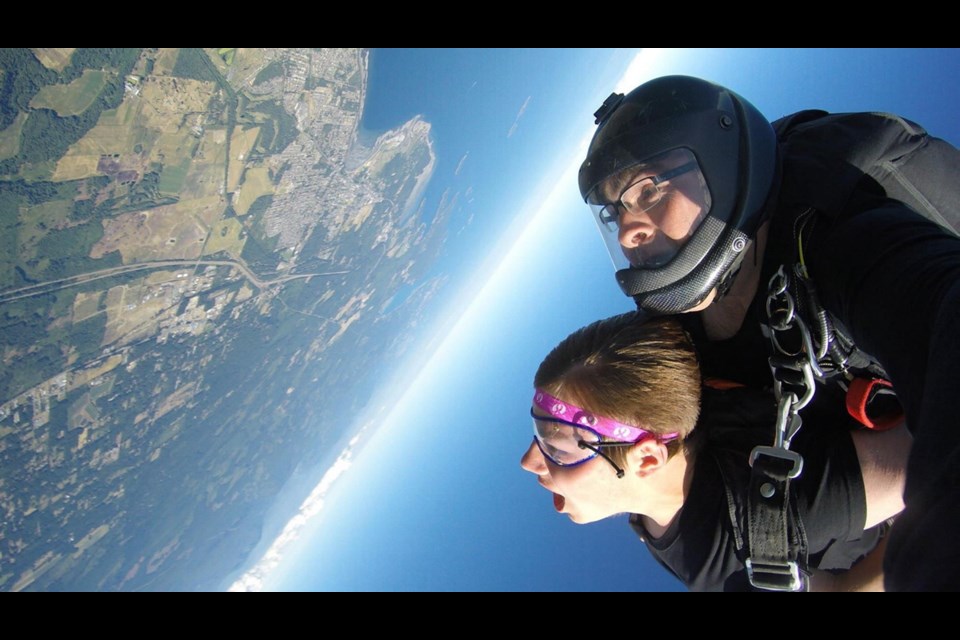 Carter Mentanczuk gets the ride of his life with Skydive Vancouver Island tandem Instructor Dennis Harker as part of the Jump for a Cure fundraiser.