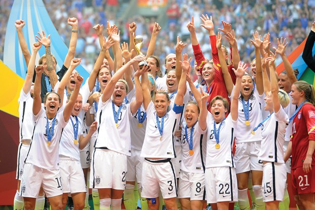 Team U.S.A. hoists the World Cup trophy after beating Japan 5-2 Sunday at BC Place.