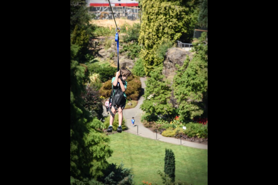 The Queen Elizabeth zipline officially opened to the public Saturday with children and adults lining up to check out the 600-foot long ride over the quarry garden. As soon as the zipline breaks the 75,000 mark in profits, revenue will be shared on a sliding scale with the Vancouver Parks Board. Photograph by: Rebecca Blissett