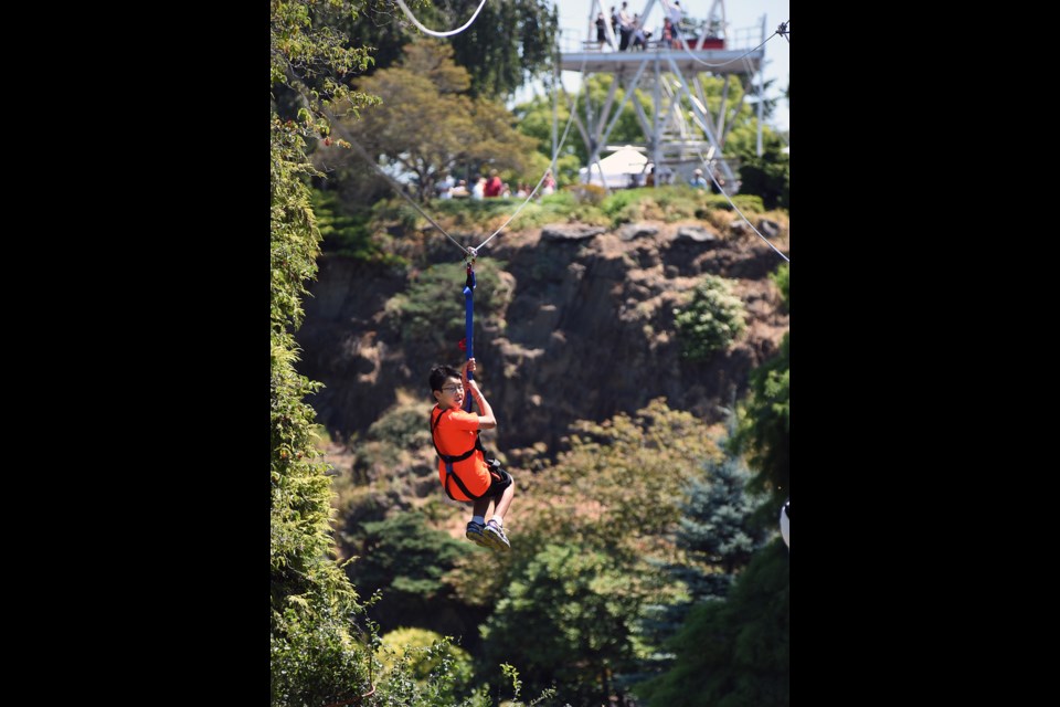 The Queen Elizabeth zipline officially opened to the public Saturday with children and adults lining up to check out the 600-foot long ride over the quarry garden. As soon as the zipline hits the 75,000 mark in profits, revenue will be shared on a sliding scale with the Vancouver Parks Board. Photograph by: Rebecca Blissett