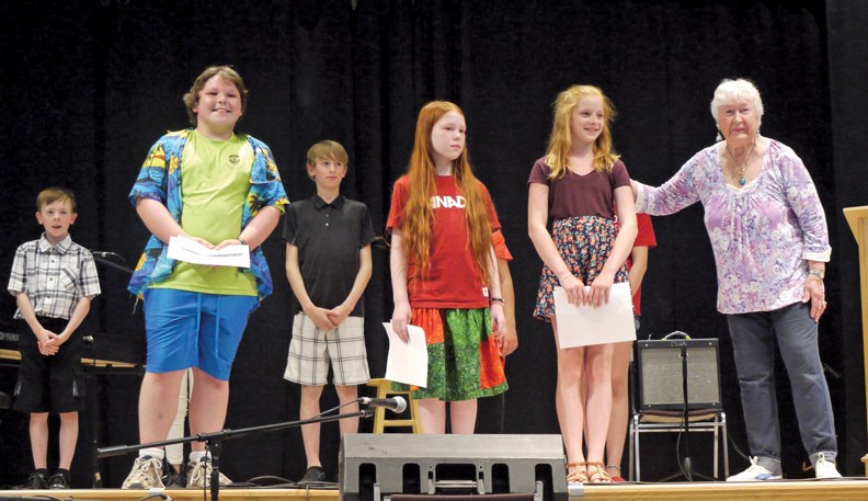 In the front row (above) are junior winners Matthew Douglas (keyboards), Kayla Payne (fiddle), and Anika Kilray (dance), with contest organizer Nikki Weber.
