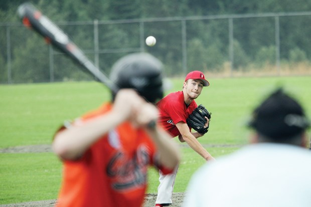 District 5 (North Shore) hurler Liam McKenzie fires a pitch in the provincial Big League baseball championship final against District 3 Saturday at Inter River Park. The North Shore boys scored an upset win in the three-game series to earn a spot in the national championships.