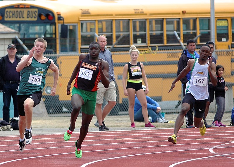 James Linde, left, and Nathan George, right, race in the 200 m dash at the B.C. Track and Field Championship in Nanaimo last weekend.