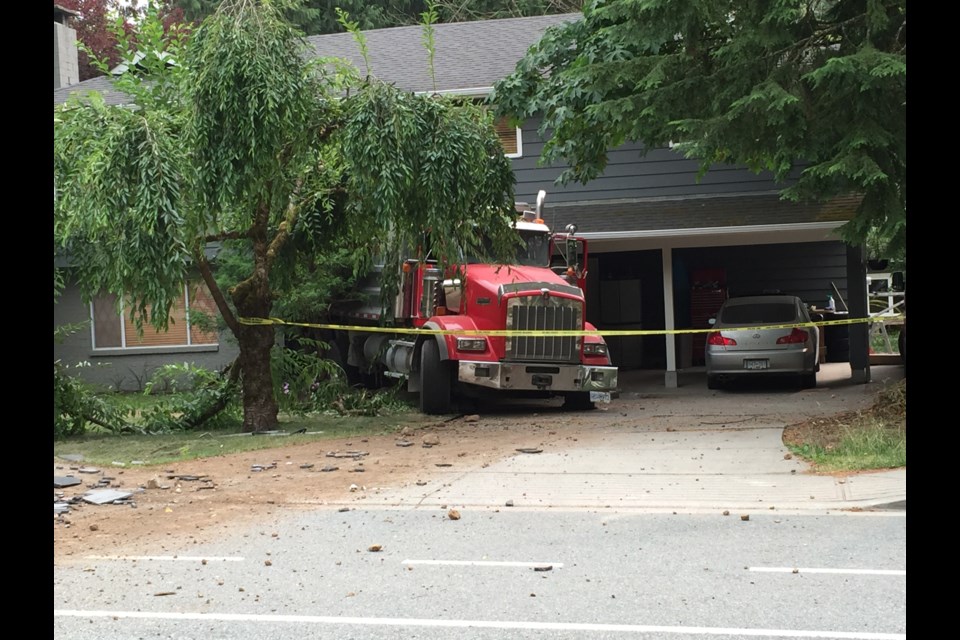 Scene from the accident July 7 in Garibaldi Highlands after an unoccupied dumptruck careened out of control backwards down the street when the driver got out to check on some spillage.