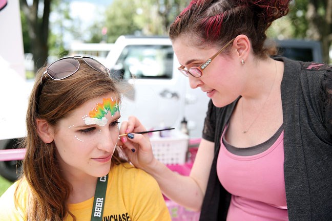Mandy Paavola of MP Make-up Artistry puts her talents to use on Delaney Davies on Saturday, July 18, at Lheidli T'enneh Memorial Park for the Party in the Park.