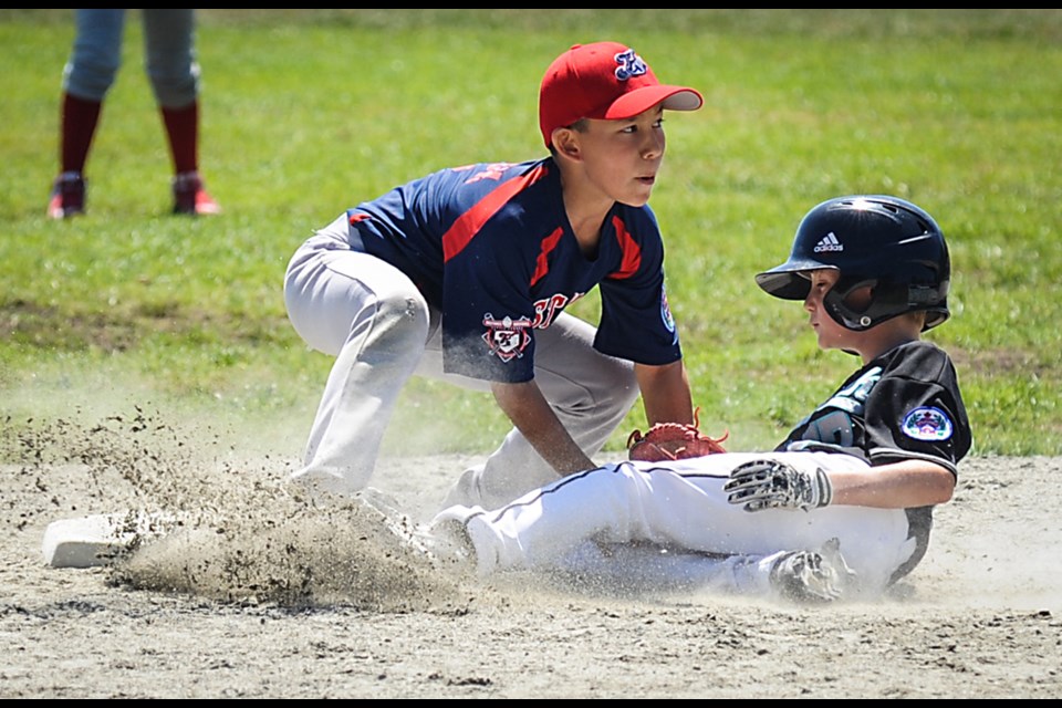 Hastings second-baseman James Brock tags the White Rock runner in the U10 Little League B.C. championship semi-final at Carnarvon Park July 18, 2015. Hastings won 8-1 but the next day lost the final 12-1 to Highlands. Photo Rebecca Blissett