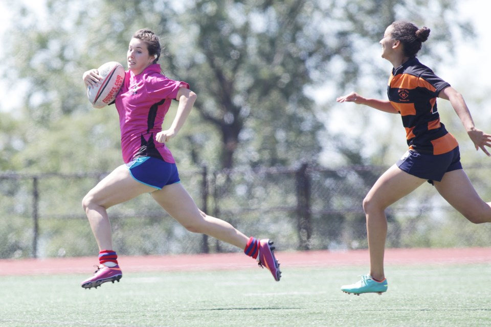 Photo by Lisa King
SFU Womens team in pink playing at 12 on field one at SFU.