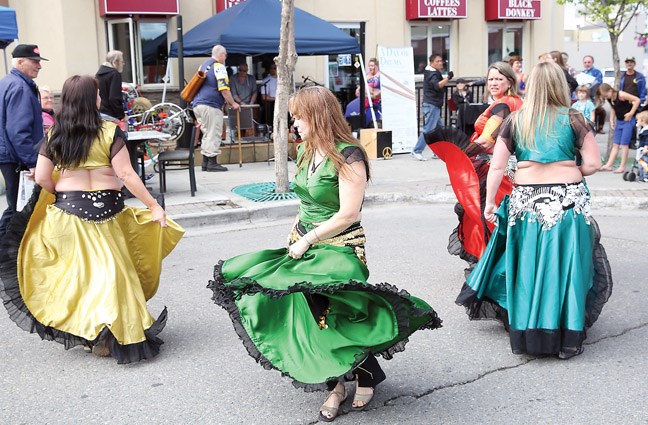 Colourful dancers from the Zahirah Dance Studio performed as local drummers jam on stage in front of the Black Donkey Cafe on Saturday, as the Tympana Percussion Society hosted A Day of Drums.