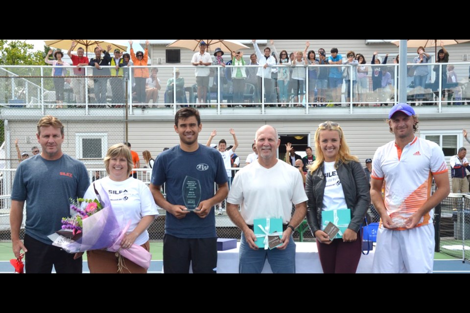 Men's singles champion Andre Dome and runner-up Matt Reid at the ITF Futures Tournament awards ceremony on Sunday at the Richmond Tennis Club