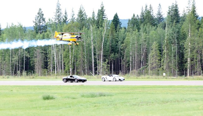 Stefan Trishcuk goes head to head against a Ferrari and Lamborghini in his custom built, one of a kind Pitts X2C biplane on Saturday as he wowed the crowds at the Quesnel Skyfest which took place Friday through Sunday in Quesnel.