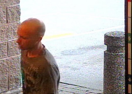 Police believe this man walked out of a Port Coquitlam liquor store with two bottles of Hennessey VSOP valued at $89.99 each.