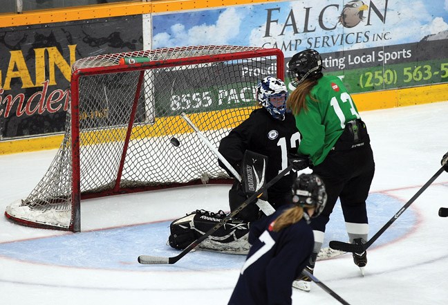 The puck just narrowly misses the net during intrasquad game of the North Capitals female midget AAA hockey team. Saturday's game saw Team Green take on Team Navy at the Coliseum.