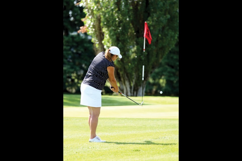 Shirley Halliday chips her ball onto the green during Sunday's final round of the Ladies Simon Fraser Open golf tournament held at the Prince George Golf and Curling Club.