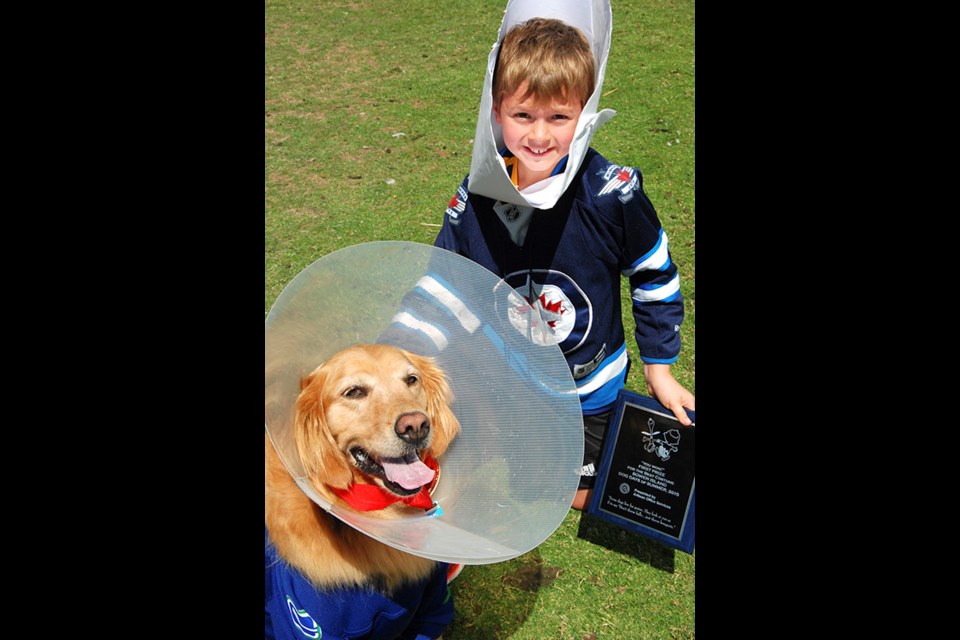 Thomas Britton and his dog Charlie might have both been on the Canucks’ injured list but they won the costumed dog prize.