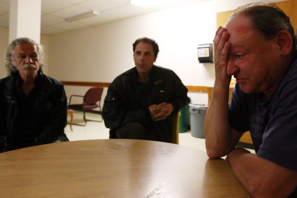 Tuesday: Ken Chalkley (L), Wadah Rashead and Zdenek Martinovsky (R), residents of a fire at 1114 Rockland Ave (Rockland Manor), talk about their experience during the fire, from the Salvation Army.