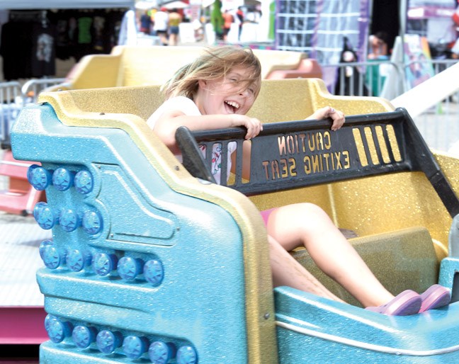 Alyssa Zimmer, 9, enjoys a ride on the Sizzler Wednesday at the BCNE. The fair goes until Sunday.
