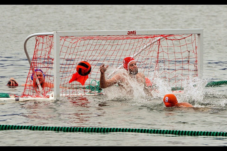 Jocely McQuade (No. 9) scores for the Electric Eels in a water polo tournament near Kitsilano Beach held during KitsFest Aug. 10, 2015. Photo Chung Chow
