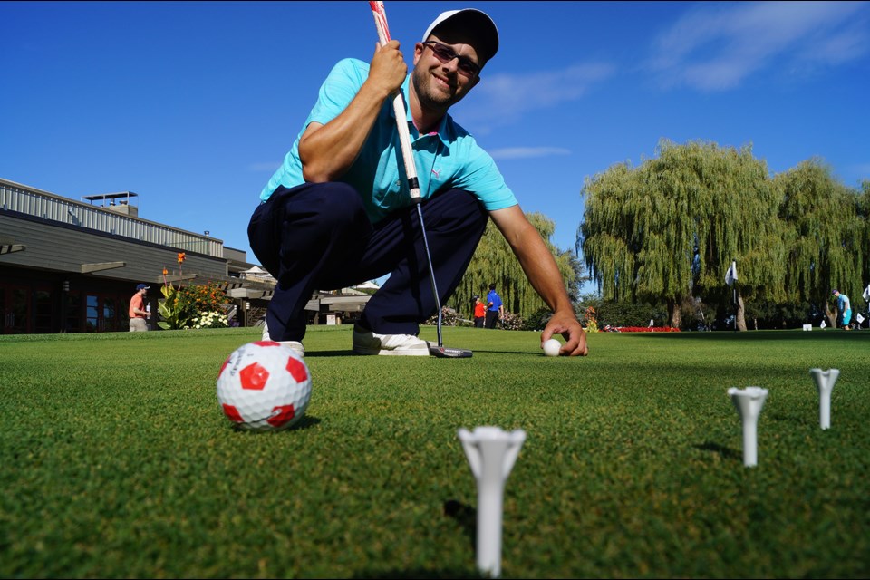 Richmond Country Club head pro Mark Strong lines up tees on the putting green. Space them out along a 20 foot span and try and hit each "section" as a means to improving your putting game.