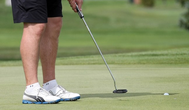 Mike Legg sinks a putt on the second hole of the final round of the Men's Simon Fraser Open golf tournament on Sunday at the Prince George Golf and Curling Club.