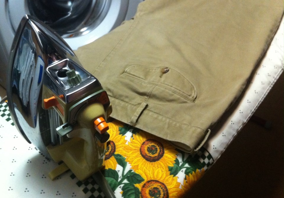 Ironing board and pants photo