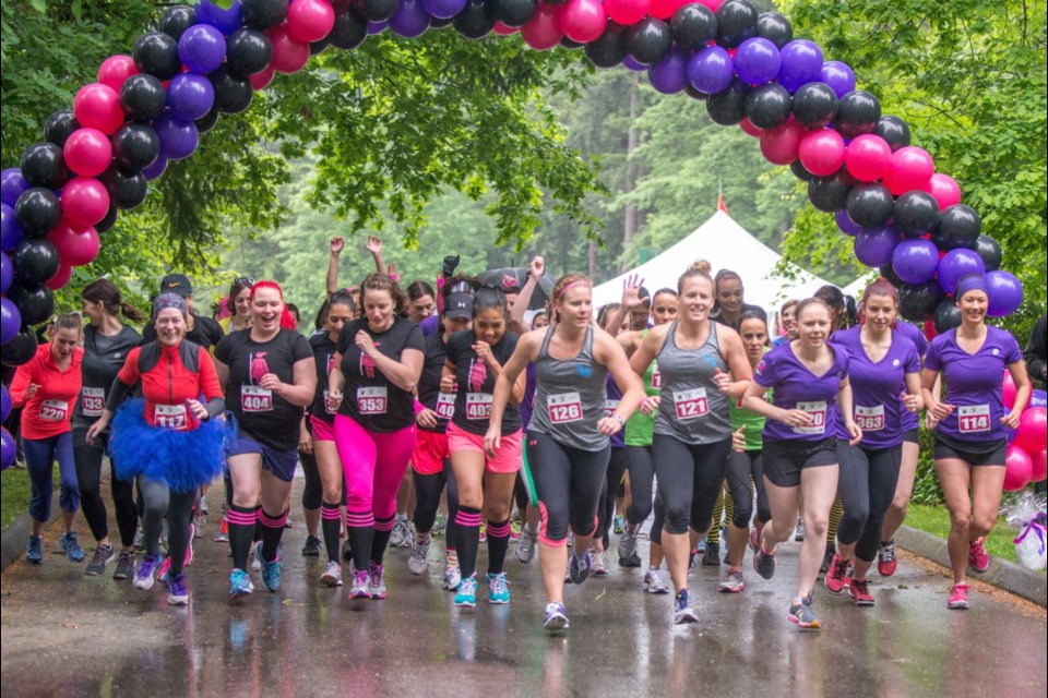 Runners sprint from the finish line of the Vancouver Woman2Warrior obstacle adventure race in May, which raised more than $125,000 for the Easter Seals Camping Program. The event will also take place in Victoria next Sunday.