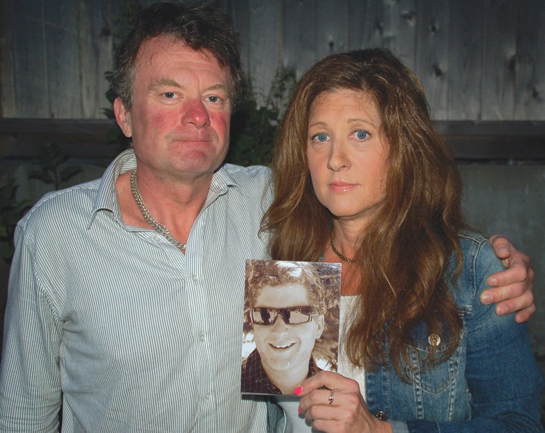 Mark and Margie Gray hold a picture of their son Myles who died on Aug. 13 after an altercation with Vancouver police in Burnaby.