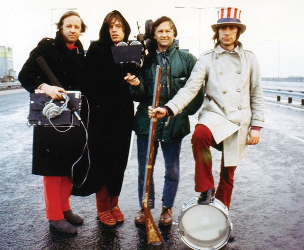 Filmmakers Albert and David Maysles pose with Rolling Stones’ Mick Jagger and Charlie Watts during a photo shoot for the Get Yer Ya-Ya’s Out! album cover on a Birmingham, England motorway in December, 1969. For North Shore News interview with Albert Maysles (1926-2015) go to http://bit.ly/1eRmtuM.