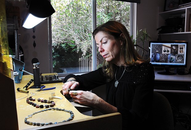 Alison Higgins works in her West Vancouver home studio. She will be selling her jewelry creations tonight at the Shipyards Night Market.
