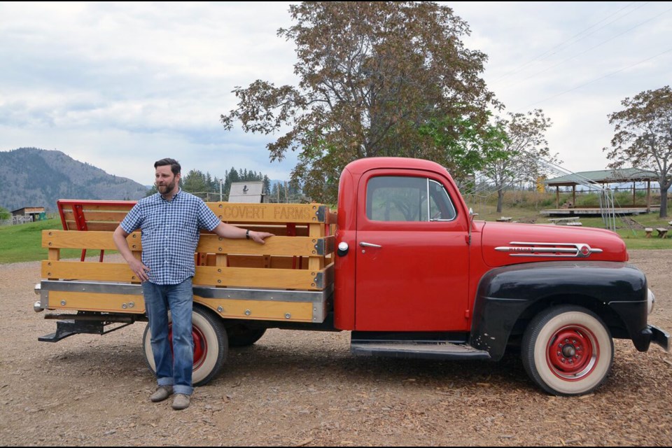 Take a tour of Covert Farms, at the foot of McIntyre Bluff just north of Oliver, in the back of this1952 red Mercury. Photo Jane Mundy