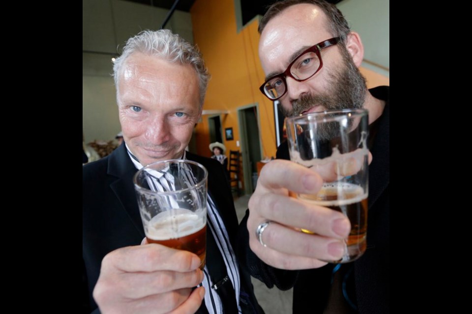 Actor Roderick Glanville, left, and Matthew Payne, Theatre SKAM's artistic producer, raise a glass to the season.