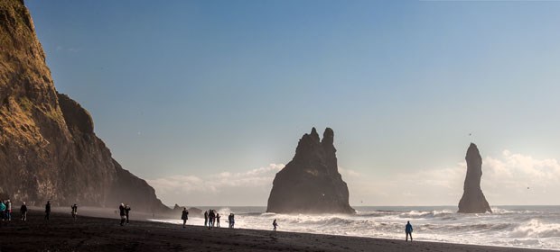 The black sand beach and rock formations at Reynisfjara are the most popular and photogenic stop on the South Shore tour.