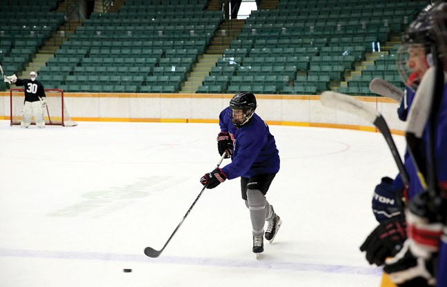 Logan Archer skates up ice with the puck. It was one of the last chances to make an impression in the Cariboo Cougars Training Camp at the CN Centre on Saturday. Team Gibb (blue) took on Team Willick (orange) in the first of two games on Saturday.