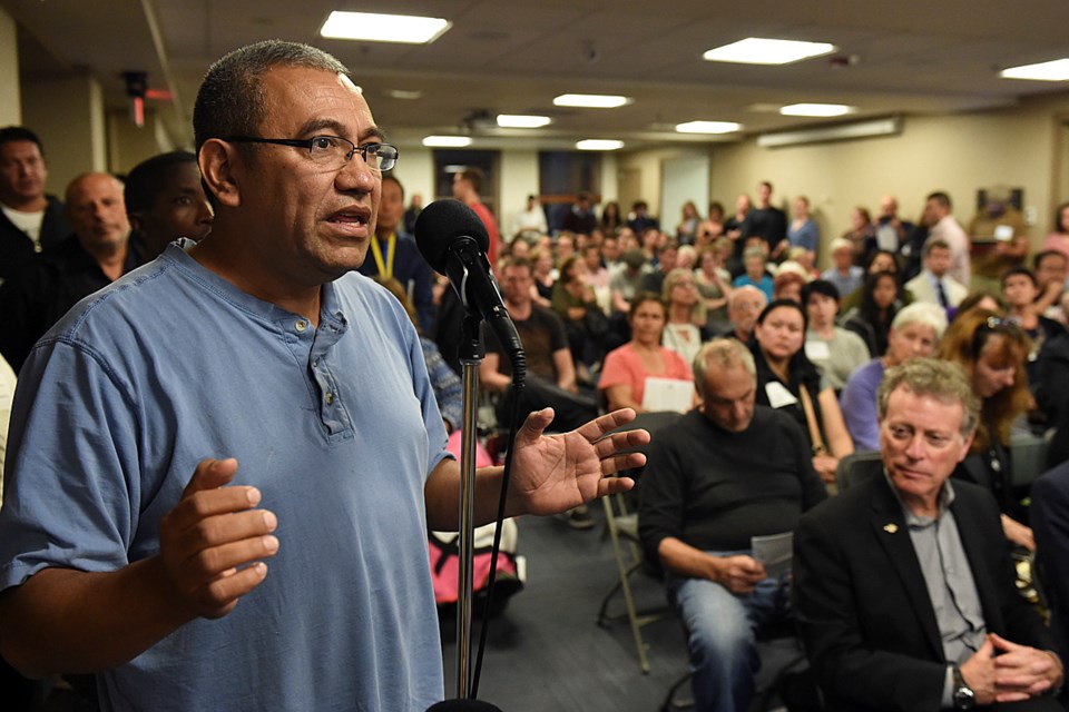 Byron Cruz was among more than 200 people who gathered at city hall Tuesday to participate in Mayor Gregor Robertson’s forum on the Syrian refugee crisis. Photo Dan Toulgoet