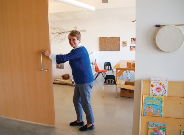 Shíshálh Nation director of education, culture and recreation, Lenora Joe, opens one of the sliding doors between classrooms to show how spaces can be joined in the Nation’s new child care centre.