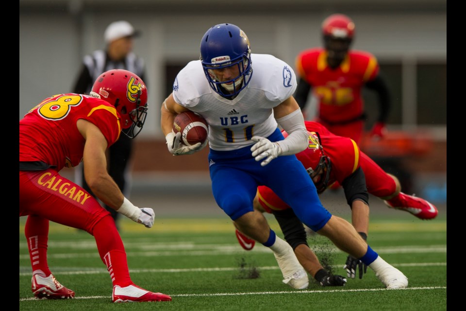 UBC Thunderbird receiver David Mann picked up 30 yards on three carries in a 49-16 loss to the Calgary Dinos Sept. 4, 2015. Photo UBC