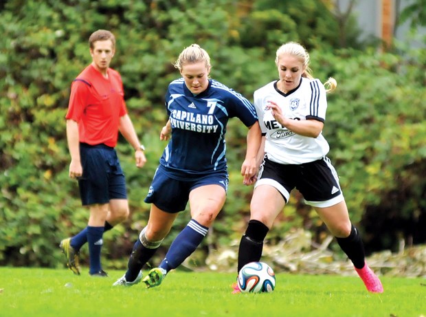 Capilano University’s Olivia Ruygrok takes on a player from the Coquitlam Metro-Ford club’s premier women’s team in exhibition action. Ruygrok is one of only a handful of returning players on a Capilano squad that also has a new coach.