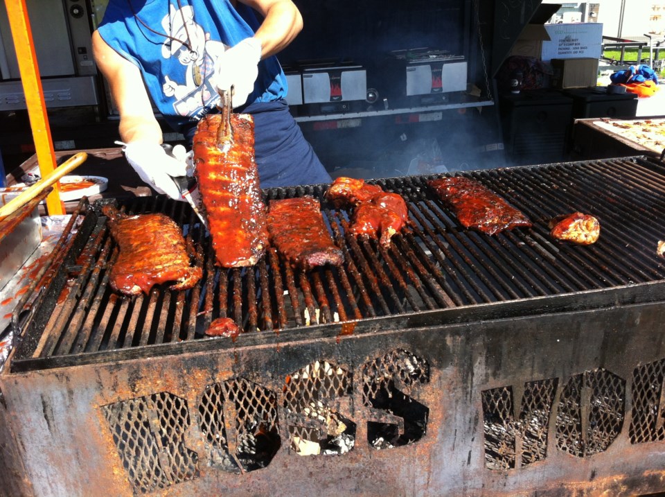 Esquimalt Ribfest: finishing ribs on the grill at the Boss Hog's booth. photo