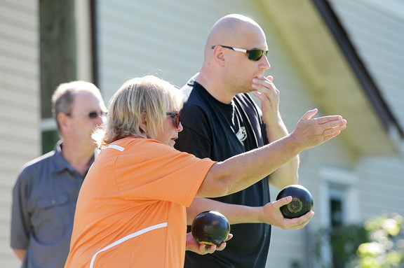 Stephanie Vezina, president of the New Westminster Lawn Bowling Club, teaches beginners how to bowl at the Queen's Park Healthcare Foundation’s lawn bowling fundraiser.