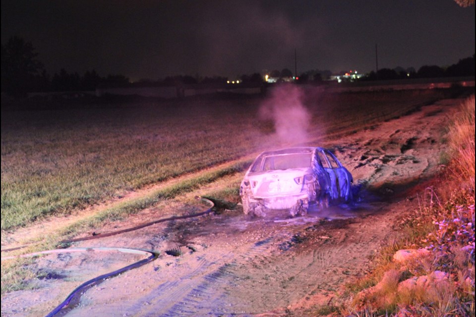 A car appears to have been set on fire in east Richmond, near No. 6 Road and Vulcan Way. The suspected arson may be linked to a suspected shooting, according to eye witnesses. Sept.14, 2015. Photo by Ryan Stelting