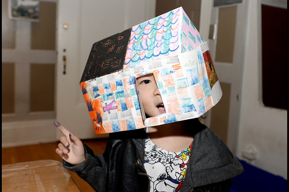 Christina Lee tries on her Dwelling Constructions studio activity at the BAG.