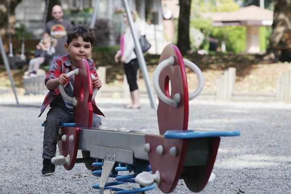 Three-year-old Niko Milic enjoyed a ride on a teeter-totter in Moody Park before it closed for a major renovation. The new-and-improved playground and spray park project is expected to be complete next spring.