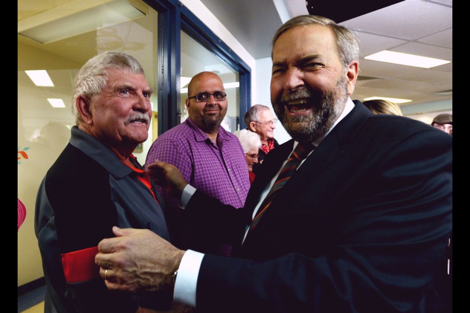 NDP Leader Tom Mulcair greets attendees during a campaign stop at the Regina Senior Citizens Centre in Regina, Sask., on Friday, Sept. 18, 2015.
