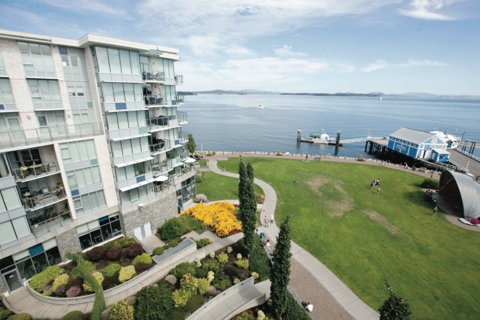The owners enjoy this view from the balcony overlooking the Sidney waterfront from their condo above Sidney Pier Hotel.
