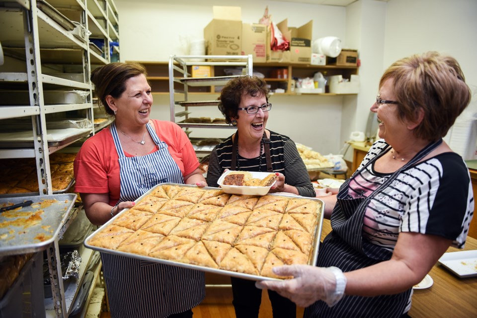 Volunteers made thousands of loukoumades during the 38th annual Greek Food Festival at the Hellenic Community of Vancouver. Loukoumades are deep-fried honey dumplings that are sometimes referred to as the Greek doughnut. Photograph by: Rebecca Blissett