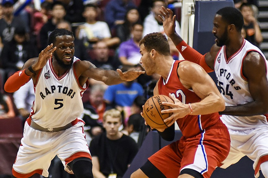 Toronto Raptors DeMarre Carroll (No. 5) and Patrick Patterson block the path ofLos Angeles Clippers Blake Griffin during a 94-72 Toronto win at Rogers Arena Oct. 4, 2015. The game was the first of four in the fourth-annual NBA Canada Series. Photo Rebecca Blissett