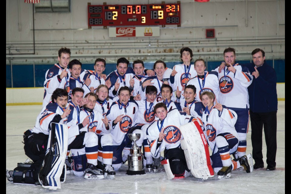 Seafair Midget A1 Islanders celebrate their fourth straight title at the 13th annual Seafair Midget Rep Hockey Tournament. The hosts went undefeated included a 9-2 win over Coquitlam in the final.