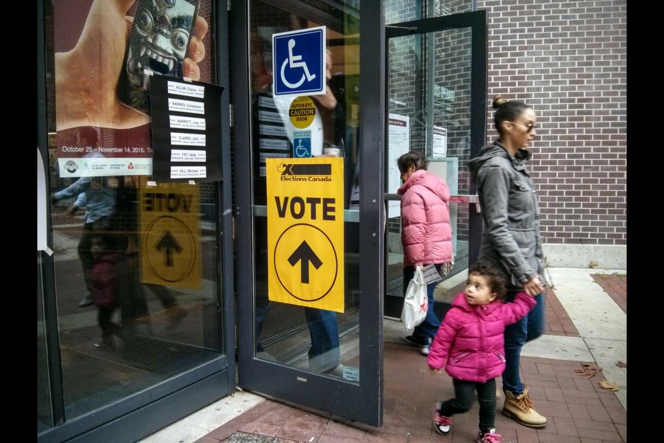Voters drop by the Roundhouse Community Centre on election day. Photo Rob Kruyt.