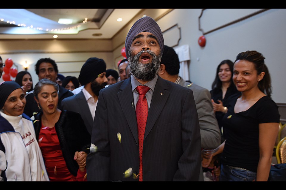 Vancouver-South Liberal candidate Harjit Sajjan watches the results of Monday night's election. In the end, he defeated Conservative incumbent Wai Young. Photo Dan Toulgoet